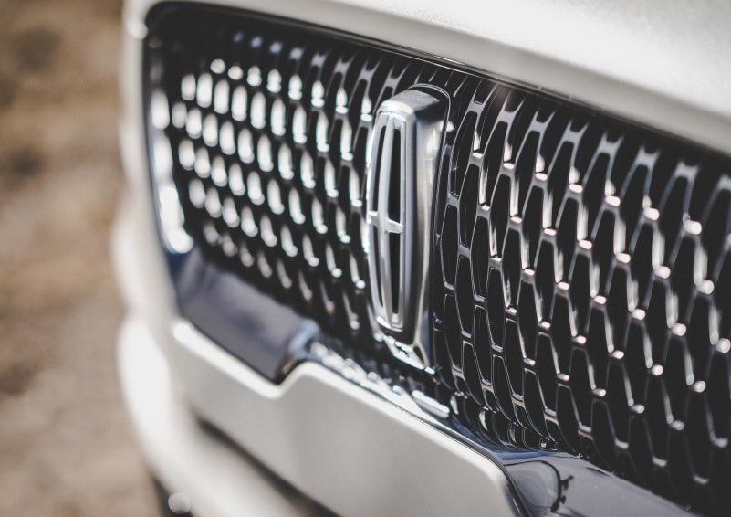 The grille of the 2024 Lincoln Aviator® Reserve model with an eye-catching repeated field of Lincoln Star logo shapes | West Point Lincoln in Houston TX