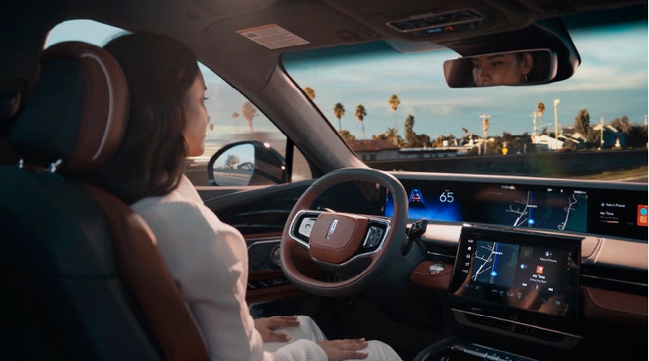 A person is shown driving hands-free on the highway with available Lincoln BlueCruise technology. | West Point Lincoln in Houston TX