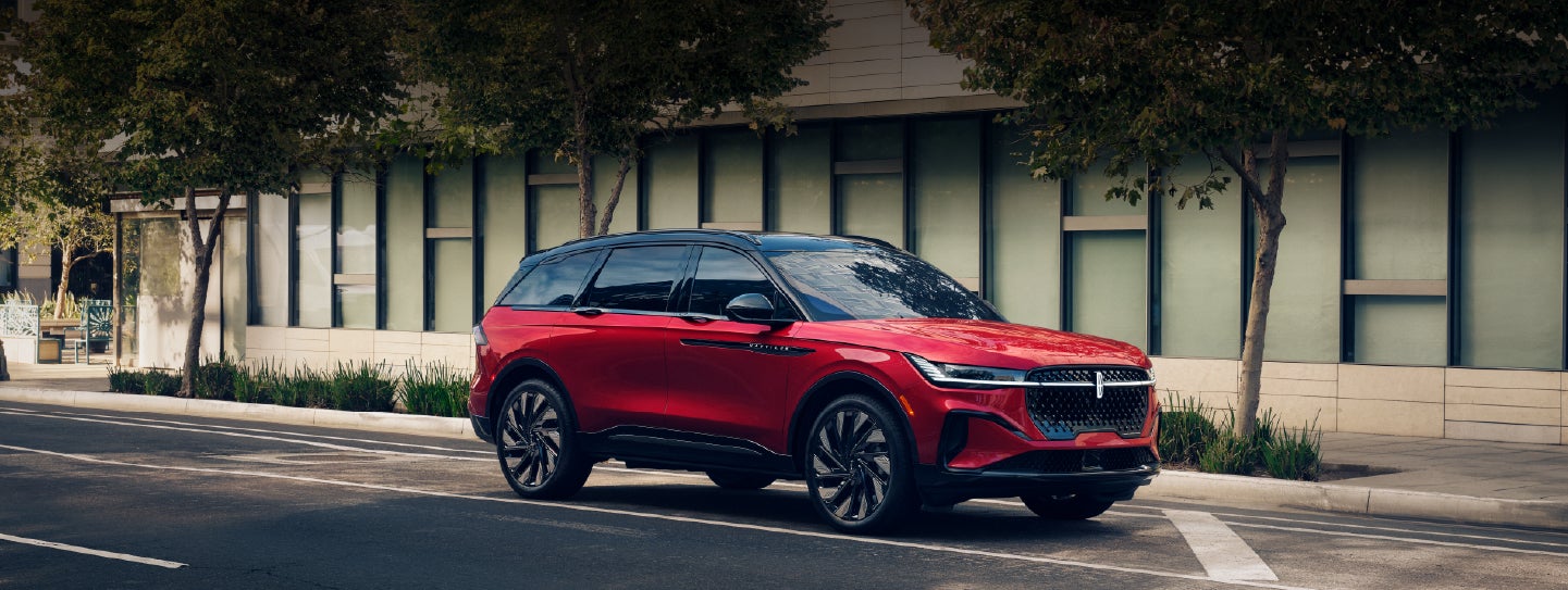 A 2025 Lincoln Nautilus® SUV with an available hybrid powertrain is parked in an urban setting. | West Point Lincoln in Houston TX