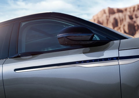 Blue lettering on the side of the vehicle that reads nautilus indicates the available hybrid powertrain. | West Point Lincoln in Houston TX