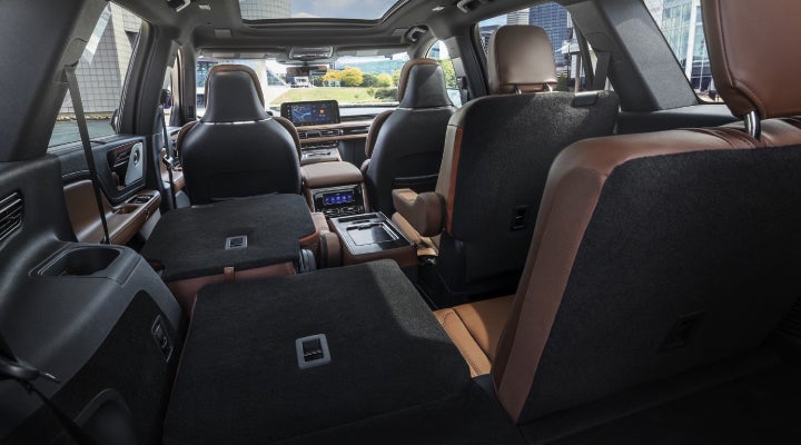 One side of the PowerFold® third-row seat and a second-row seat are folded forward in the 2026 Lincoln Aviator® SUV. | West Point Lincoln in Houston TX