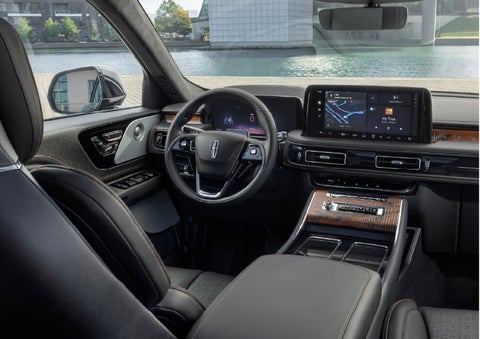 The interior of the 2026 Lincoln Aviator® SUV is shown parked with a view of a harbor through the windshield. | West Point Lincoln in Houston TX