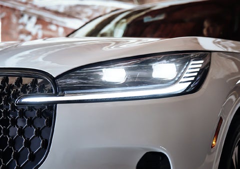 A close-up of a headlamp on the 2027 Lincoln Aviator® SUV is shown. | West Point Lincoln in Houston TX