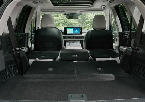 A rear to front view of the interior of a 2027 Lincoln Aviator® Black Label™ SUV shows the third and second rows folded flat | West Point Lincoln in Houston TX